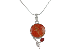 This beautiful orange colour round Sponge Coral pendant is set in an open back bazel.