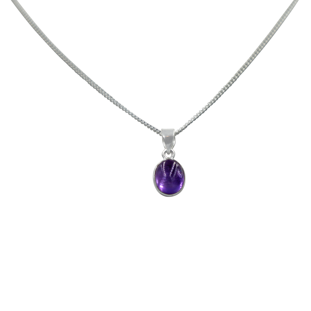 Slight oval simple cabochon Amethyst stone set on a thin bezel setting