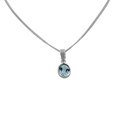 Stunning oval faceted Blue Topaz on a thin bezel setting exposing much of the shiny stone