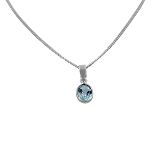 Stunning oval faceted Blue Topaz on a thin bezel setting exposing much of the shiny stone