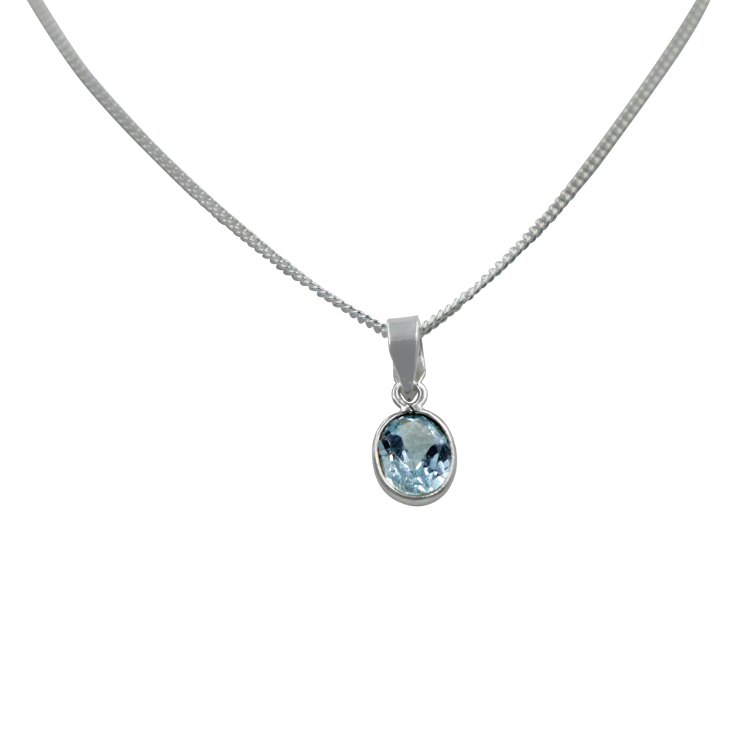 Stunning oval faceted Blue Topaz on a thin bezel setting exposing much of the shiny stone