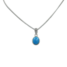 Load image into Gallery viewer, Slight oval simple cabochon Turquoise set on a thin bezel setting
